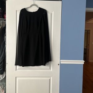 Black Calvin Klein evening dress. Had a built in sheer cape. Very flattering.